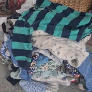 stack of baby clothes used for a keepsake